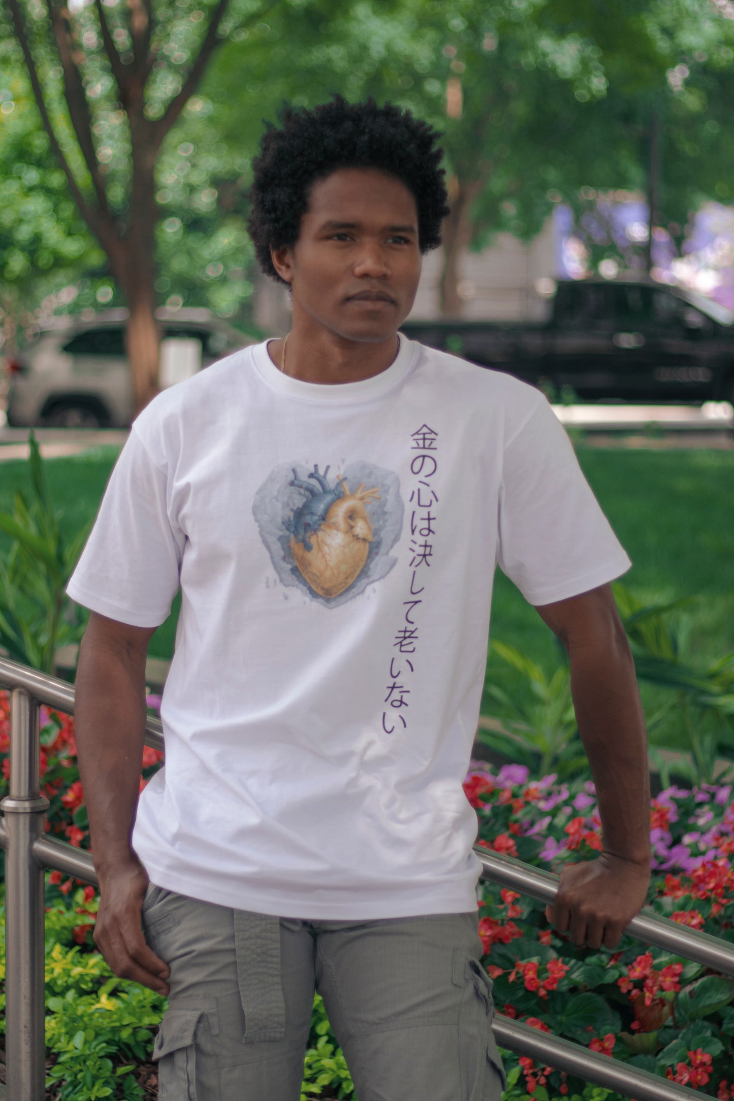 Voyager Gold heart cotton t-shirt modeled by Vidal Dias outside the federal reserve in Atlanta GA